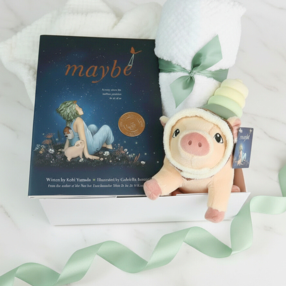 Plush pig toy with a book titled 'maybe' on a white background