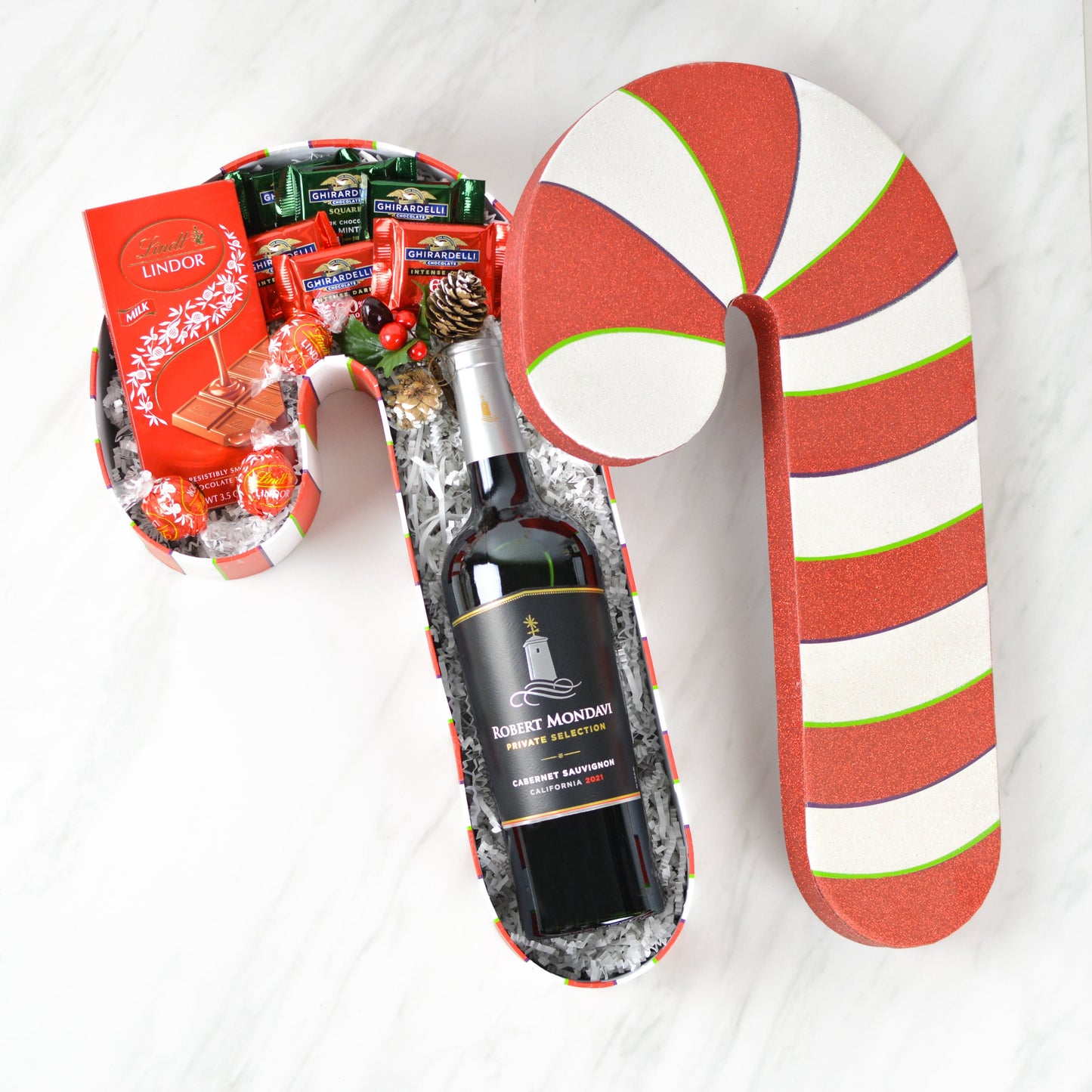 Candy cane shaped holiday gift box with Robert Mondavi Cabernet Sauvignon and assorted chocolates
