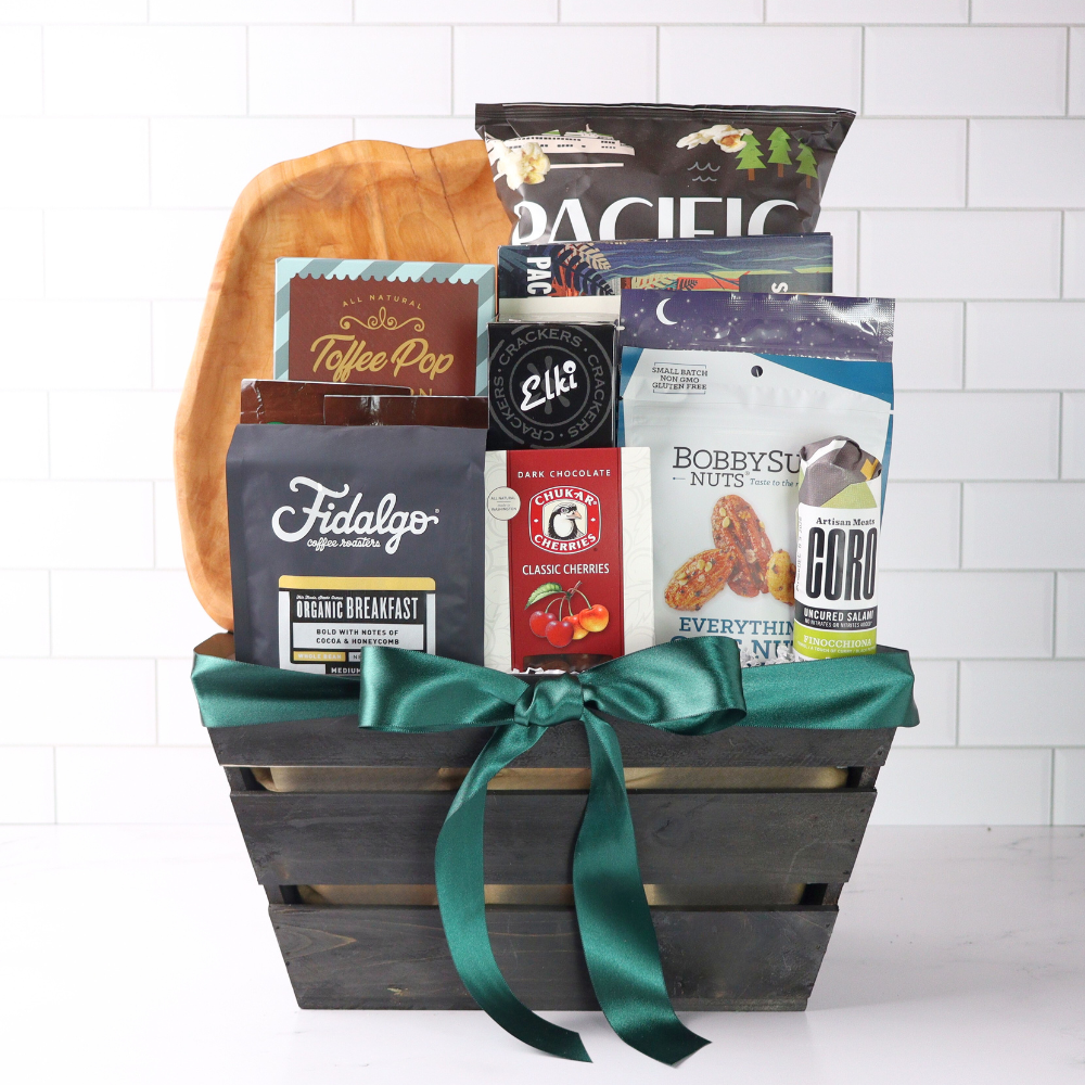 Gift basket with snacks and drinks on a white background