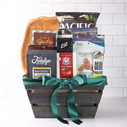 Gift basket with snacks and drinks on a white background