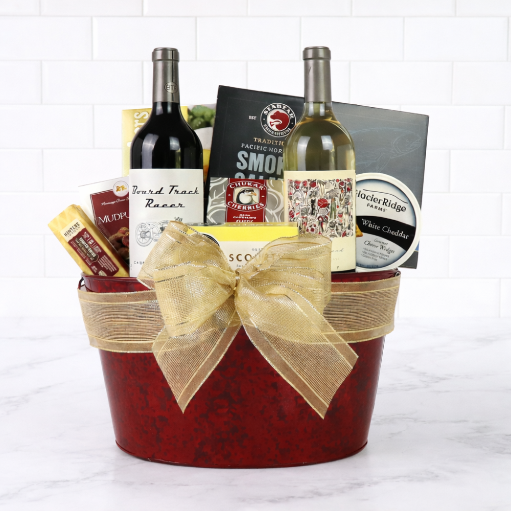 Gift basket with wine bottles, snacks, and a bow on a white background
