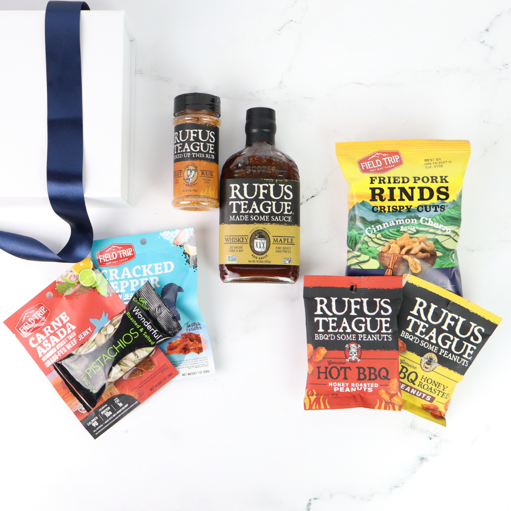 Assorted Rufus Teague products including sauces and rinds on a white background