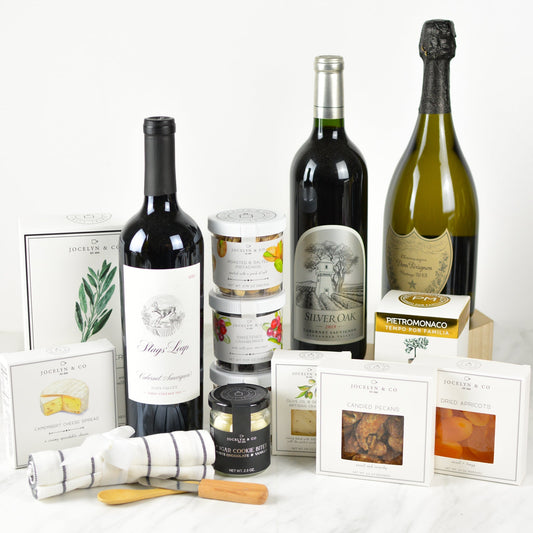The Ultimate Celebration Collection of wine and champage along with gourmet snacks including crackers, cheese, chocolate, nuts and fruit spread for gift basket drop shipping